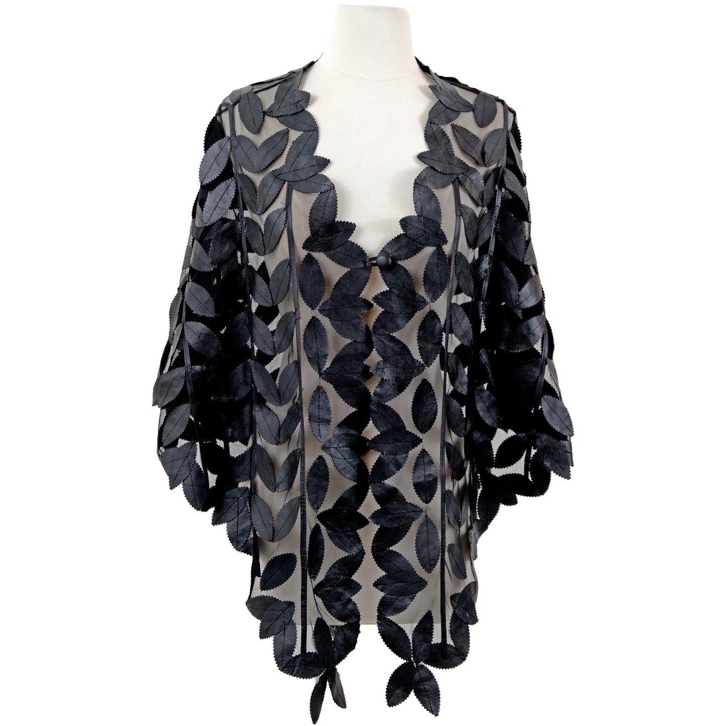 Leaf Design Leather Poncho detail view — leaf-cut pattern