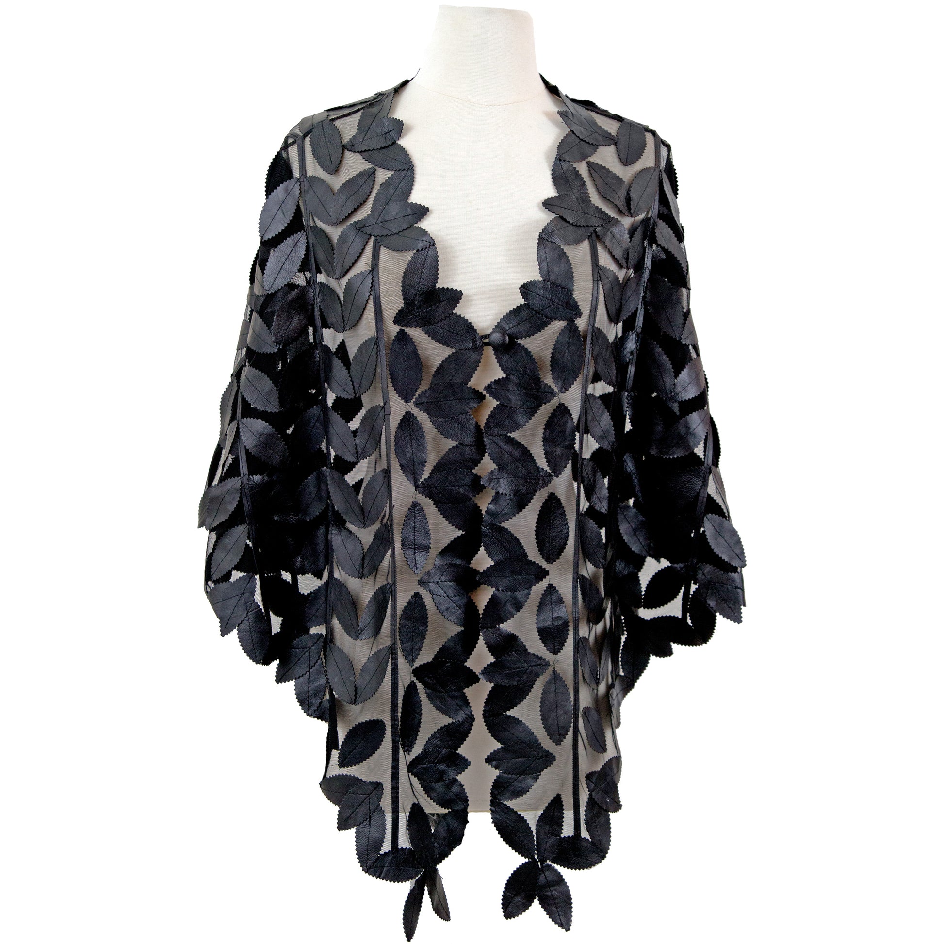 Leaf Design Leather Poncho detail view — leaf-cut pattern